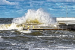 big braking waves during a gale in Kolobrzeg on the coast of the Baltic sea in Poland