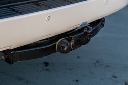 Close up, black car tow hitch, view of the vehicle hitch closeup