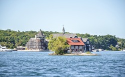One Island with a small house in Thousand Islands Region in summer in Kingston, Ontario, Canada