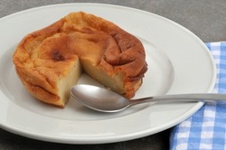 Far breton in a plate with a spoon 