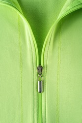 Half zipped cotton sweatshirt hoodie close-up. Fashionable summer light green jacket with zipper fastening. Casual outerwear and trendy clothes in bright colors concepts. Zip fastener of pullover. 