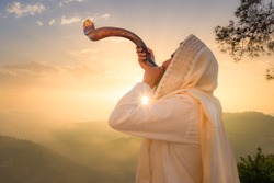 A Jewish man blowing the Shofar (ram's horn), which is used to blow sounds on Rosh HaShana (the Jewish New Year) and Yom Kippurim (day of Atonement)