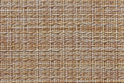 The table mat is brown, woven from thin plastic rods.