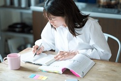 Adult woman studying with text
