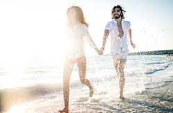 Young couple sharing happy  and love mood on the beach