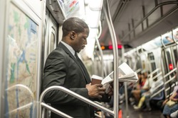 Businessman in full suit in New York subway metro