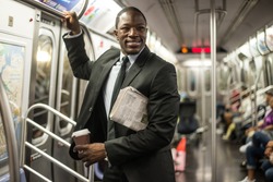 Businessman in full suit in New York subway metro