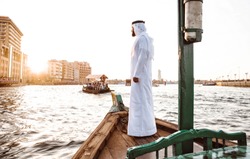 Arabic man on a traditional boat in Dubai