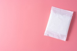 Sanitary pad, Sanitary napkin on pink background. Menstruation, Feminine hygiene, top view.