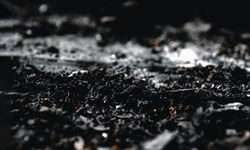 Black abstract background. Black scorched earth. The concept of the destruction of all living things. Black tea