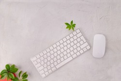 White keyboard and white mouse computer on gray texture background with copy space