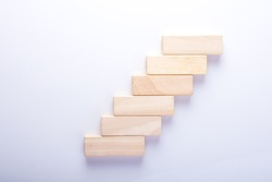 Wood block stacking as step stair, Business concept for growth success process.