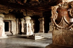 Interior design of ancient Indian stone temple, Ajanta caves (rock-cut Buddhist cave monument). Beautiful carved wall and pillars. 