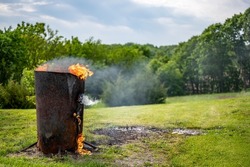 Burn barrel in a rural area used to incinerate trash and garbage. 