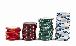 Stacks of colored poker chips isolated on white background