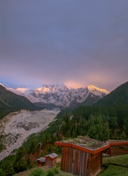 huts in mountains with beautiful valley and snow mountains , nanga parbat from fairy meadows , gilgit baltistan Pakistan 