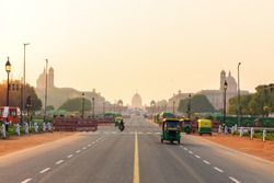 Sunset traffic in New Delhi, India, tuc tuc cars on the road to the Presidential Residance