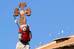 scallop shell on pilgrim backpack on a large cross of the saint on Camino de Santiago  to Compostela , in  León, Spain
