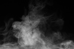 Blur white water vapour on isolated black background. Abstract of steam with copy space. Steam flow. Smoke on white background.