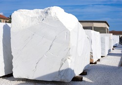 White marble blocks. Depot of  marble factory, work stone in Italy. Selective focus.	