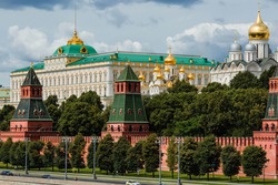 View of Moscow on a summer day. capital of Russia. Grand Kremlin palace. Church Of The Kremlin. Kremlin embankment. river Moscow. Popular tourist attraction. Business card of Moscow.