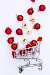 Grocery basket with red balloons and letters.The inscription in English: 
