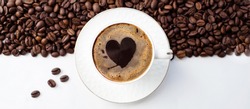 Banner.Cafes and restaurants. A mug of invigorating, black coffee with heart shaped foam and coffee beans in a bag on a white background. Place for an inscription. The concept of hot drinks and love.