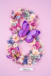 International Women's Day. Banner, flyer, beautiful postcard for March 8. Flowers and butterflies in the shape of the number eight on a pink background.