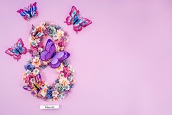 International Women's Day. Banner, flyer, beautiful postcard for March 8. Flowers and butterflies in the shape of the number 8 on a pink background.