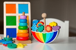 Balancer toys. Children's wooden toy in the form of an umbrella, color pyramid and educational logic toys for children. Montessori Games for child development.