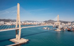 Aerial view of Busan Harbor Bridge on a sunny day