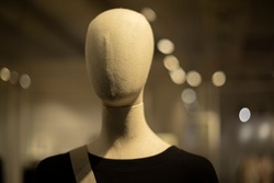 Mannequin made of fabric for clothes. Head without face. Figure of man.
