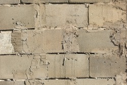 Concrete wall. Raw wall surface. Stonework. Gray surface.