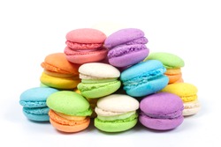 Pile of colorful macaroons is a french sweet delicacy isolated on white background.