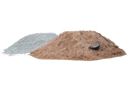 Pile of sand, gravel or stone, shovel and clam-shell shaped basket in construction site isolated on white background included clipping path.