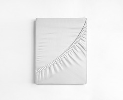 Flat sheet or bed cover folded. White fitted sheet against a white background. White sheet with elastic band.