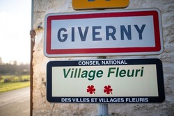 road sign of the French village of Giverny where the impressionist painter Claude Monet lived