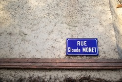 Panel showing the street of Claude Monet, French impressionist painter in Giverny village
