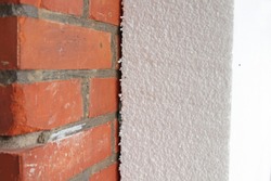 polystyrene insulation panel on brick wall