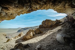 USA, Nevada, Churchill County, Lahontan Mountains, Grimes Point Archelogical Site. A view looking towards Hidden Cave entrance from inside Picnic Cave (Rockshelter).