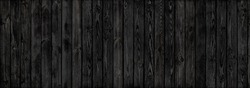 black weathered wooden planks with paint flakes