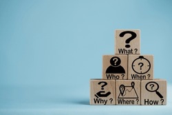5W1H Root cause analysis.,Wooden cubes with the words and icons What, When, Why, Who, Where, and How on a blue background use for business concepts such as problem-solving and strategic planning.