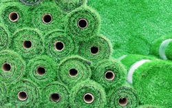 Artificial grass in rolls to cover tennis courts, sports fields, golf courses and football.