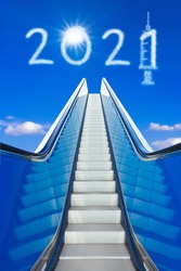 Better New Year concept. 2021 text and syringe icon on blue sky, signifying an end to the covid pandemic.