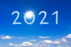 Better New Year concept. 2021 text on blue sky during a sunny day, signifying a brighter and better future.