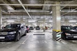 Large modern underground parking for cars. New underground car parking, garage