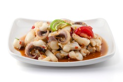 Spicy seafood salad with Squid isolated on white background, Somtum Talay, Thai food.