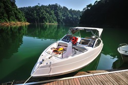 Fishing boat (tourist boat ) at tropical rain forest at Kenyir Lake in Terengganu, Malaysia, It is the largest man-made lake in South East Asia.