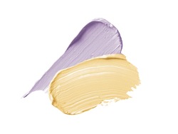 Color corrector strokes isolated on white background. Yellow and lilac color correcting concealer cream smudge smear swatch sample. Makeup cosmetic creamy texture