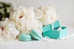 Tiffany blue macarons with peony and gift boxes 